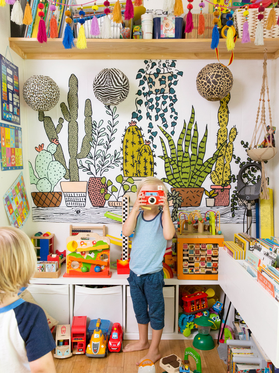 Kids playing with toys at home by Austin lifestyle photographer Buff Strickland
