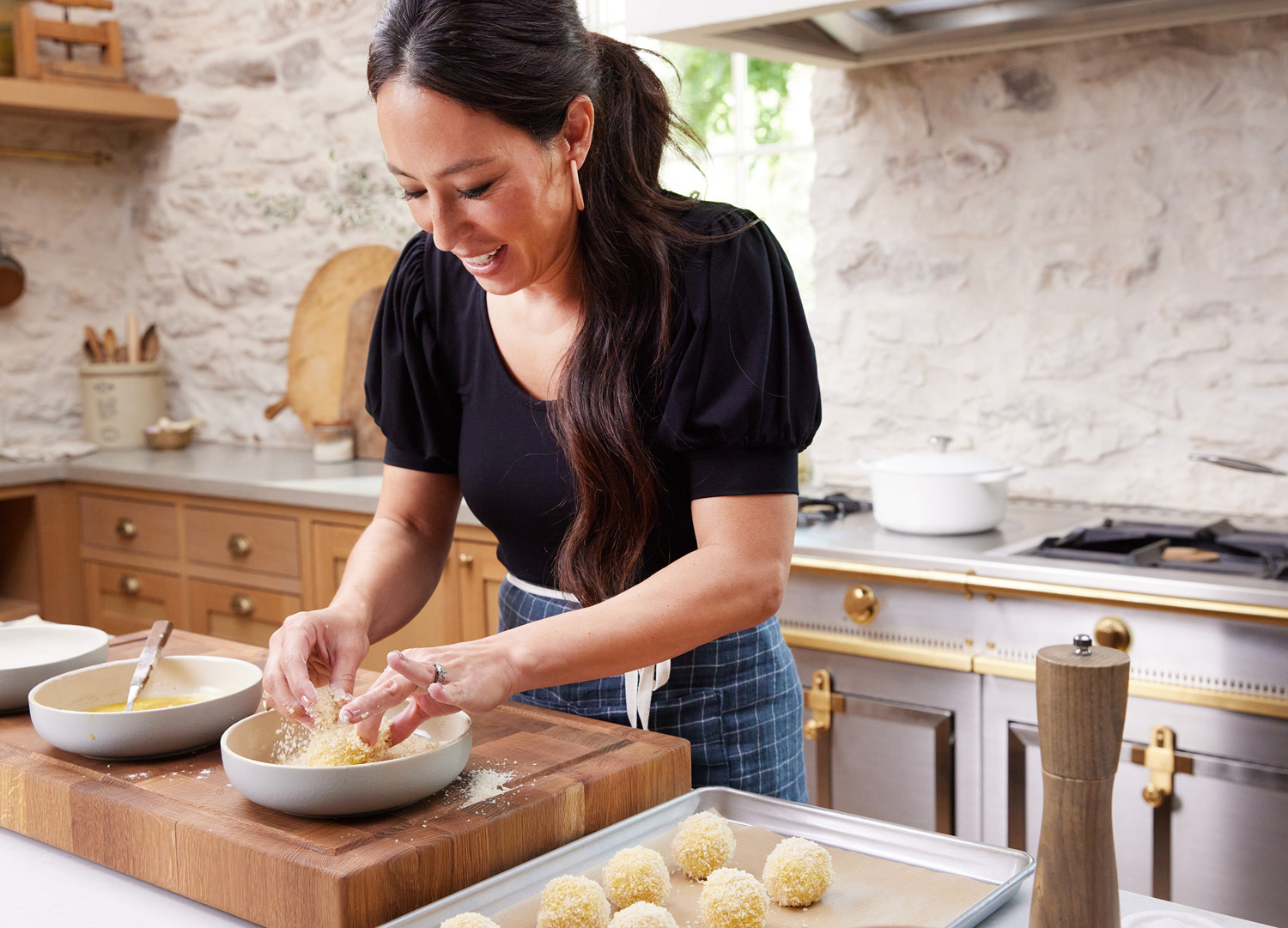 Joanna Gaines of Magnolia Network cooking by lifestyle photographer Buff Strickland