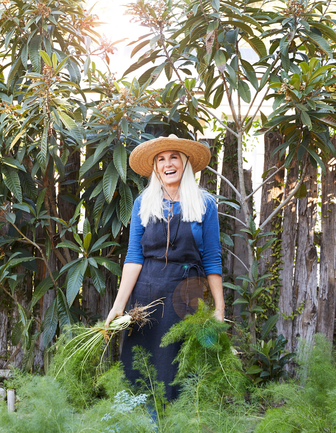 Texas gardener with bounty by Austin lifestyle photographer Buff Strickland