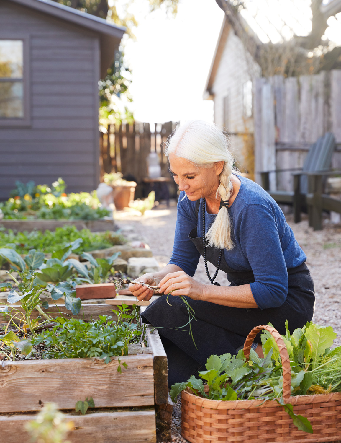 Older woman gardening by lifestyle photographer Buff Strickland