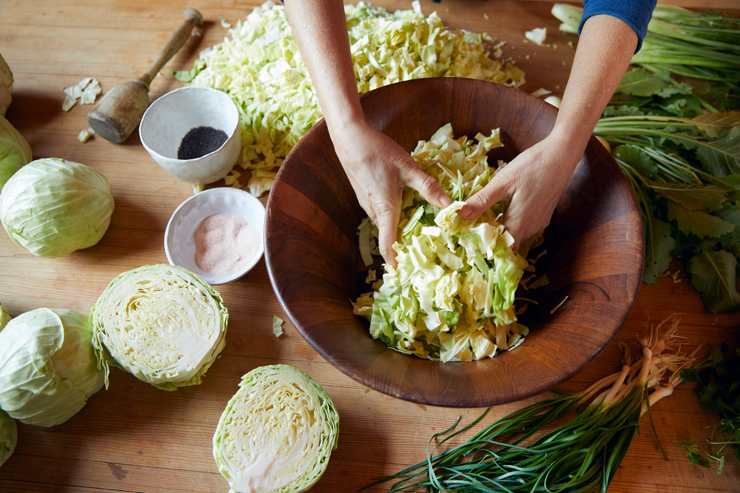 Homemade sauerkraut with hands by food and lifestyle photographer Buff Strickland