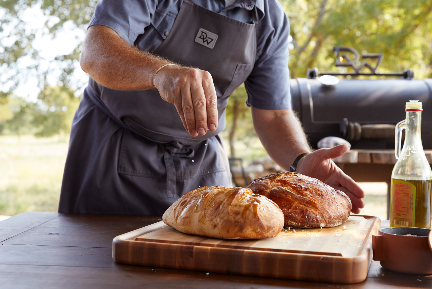 Driftwood Golf Club shoot of chef making bread outdoors by lifestyle photographer Buff Strickland