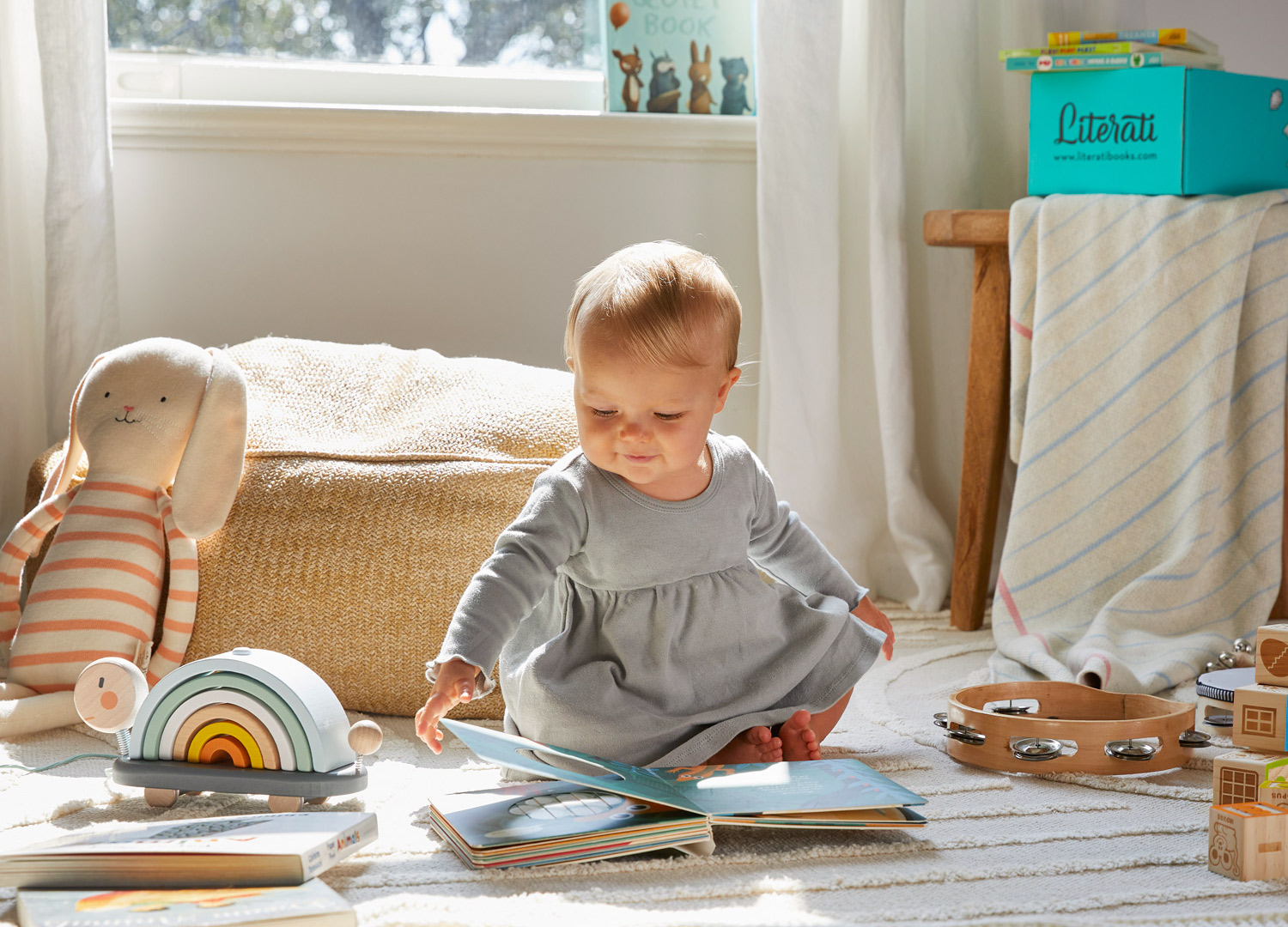 Literati baby reading by Austin based kids photographer Buff Strickland