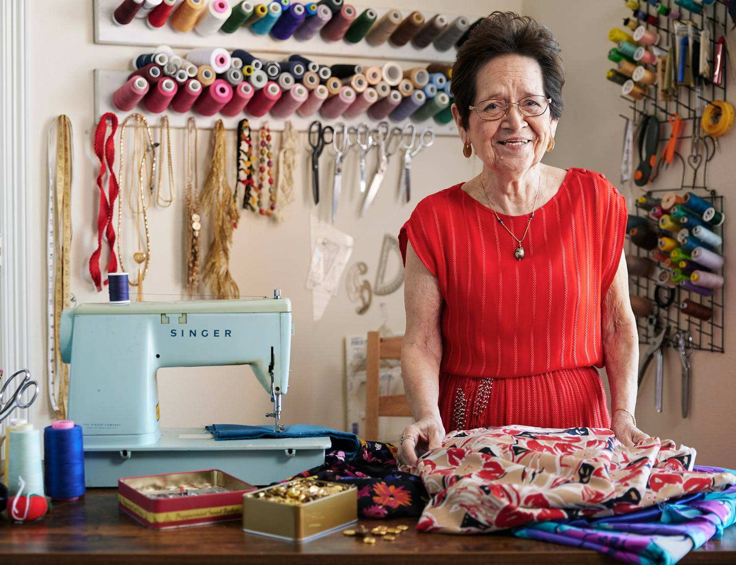 Senior living resident sewing by lifestyle photographer Buff Strickland