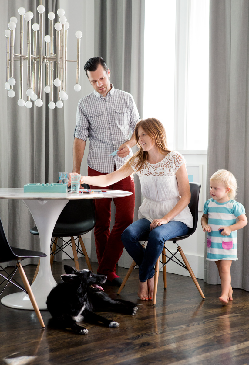 Hatch Works owners at the kitchen table with daughter in modern setting