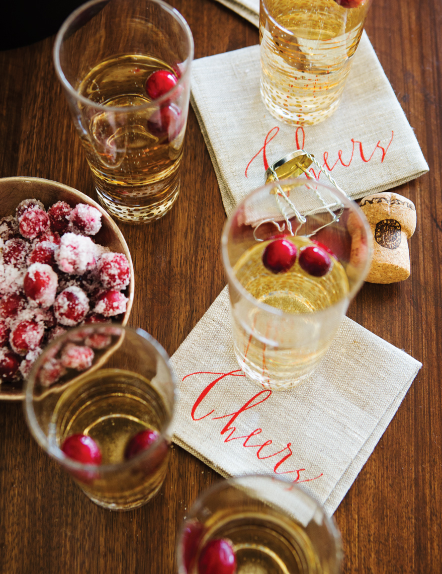 Camille Styles Entertaining book champagne and West Elm Cheers napkins