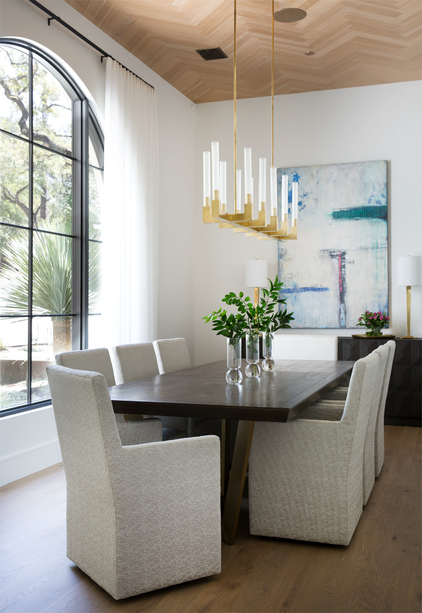 Modern dining room with chandelier by Austin based interior photographer Buff Strickland