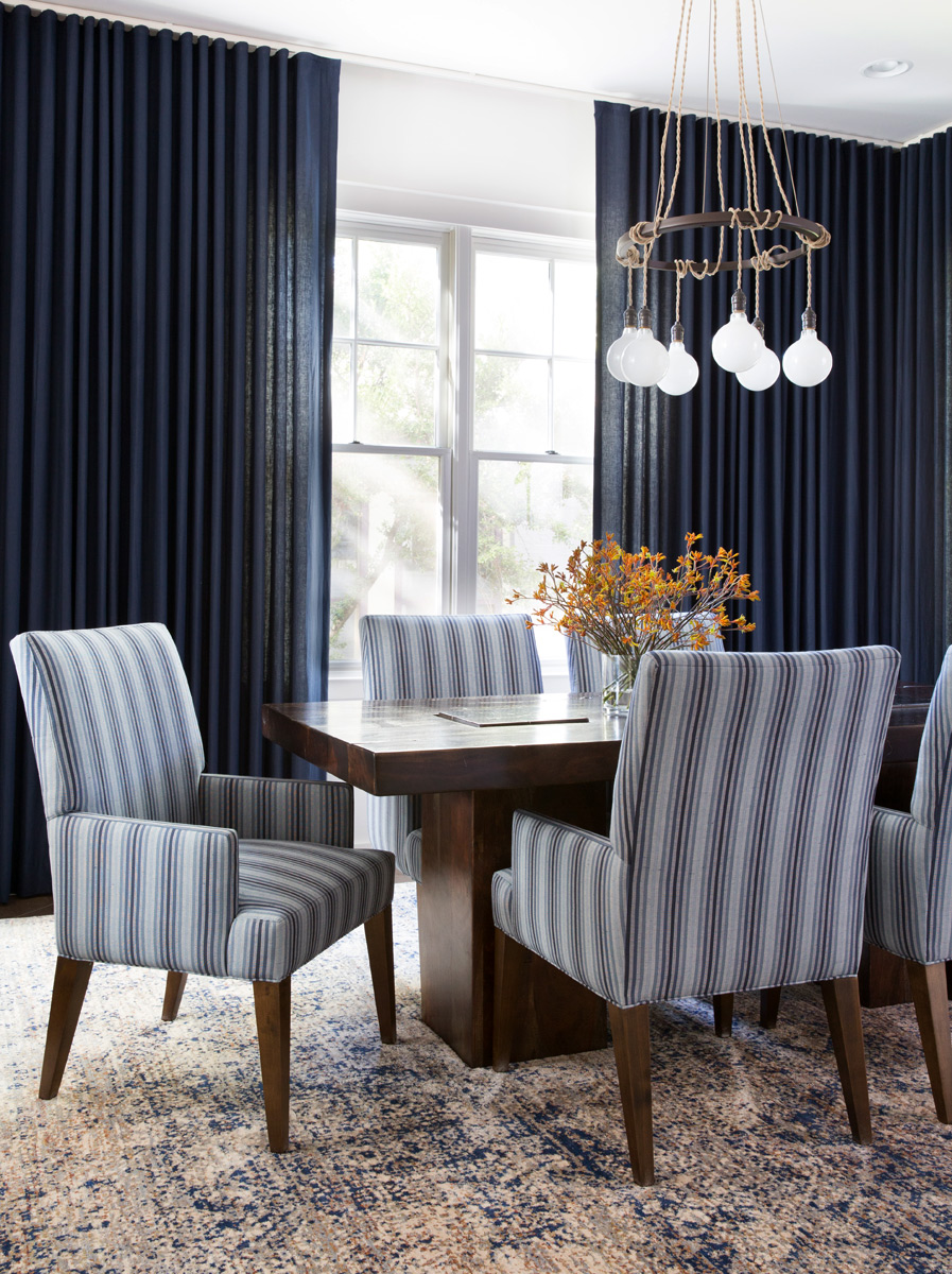 Dark blue dining room decor by interior photographer Buff Strickland