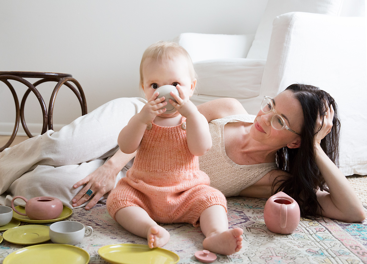 Artist Kelly Colchin photographed with her child lifestyle photographer austin