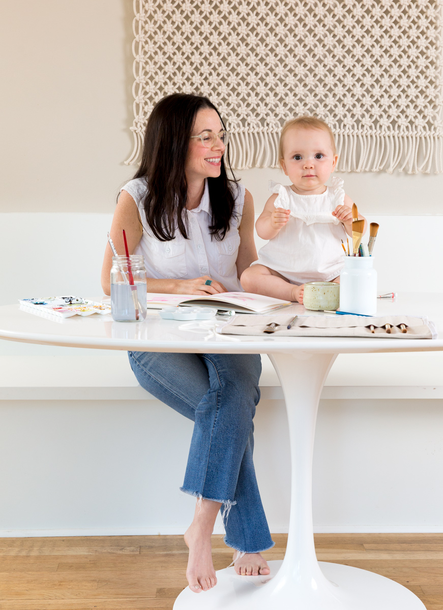 Artist Kelly Colchin and daughter painting together