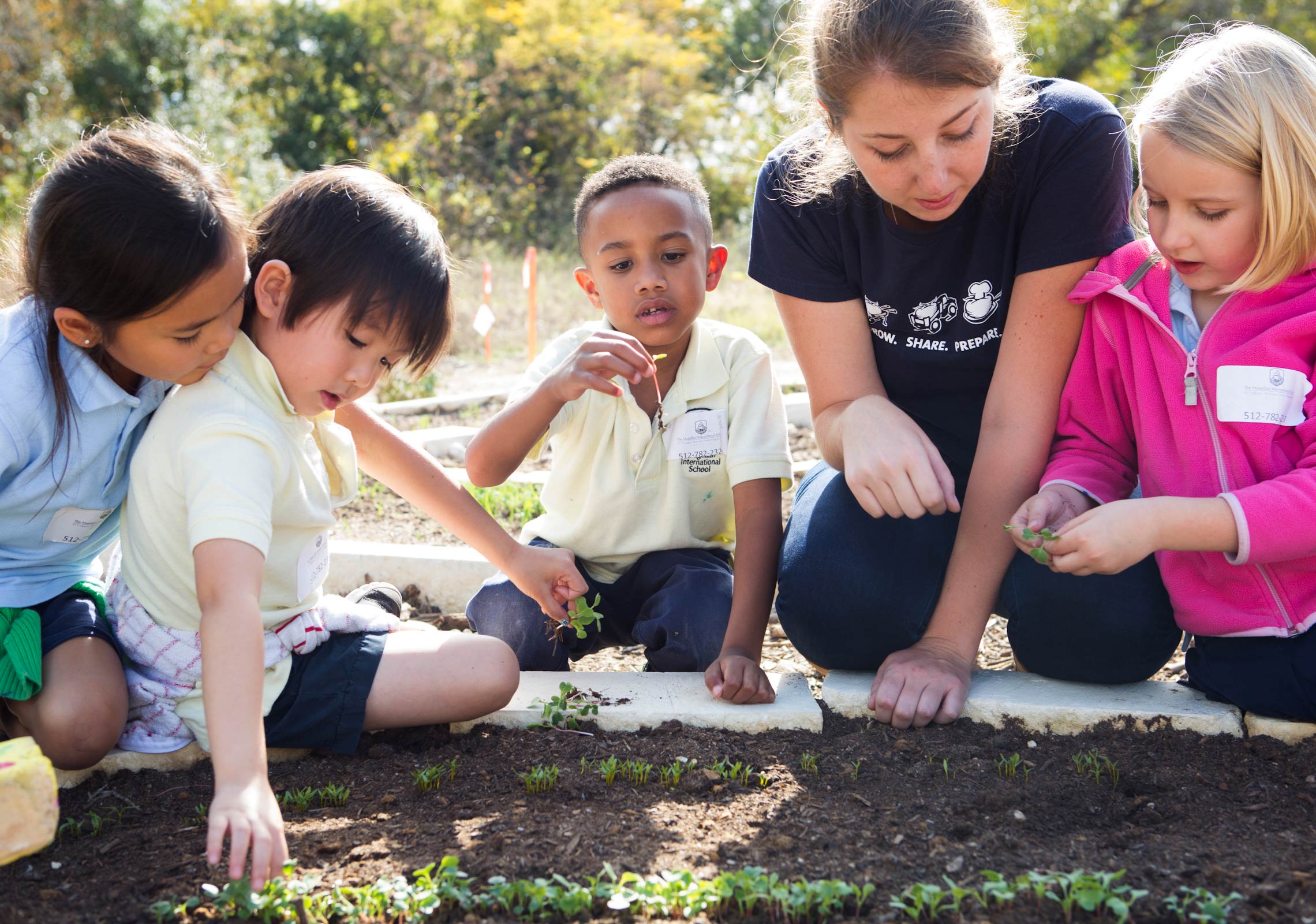group of kids gardening class