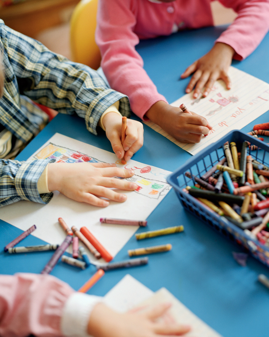 kindergarten kids hands with crayons by kid photographer Buff Strickland