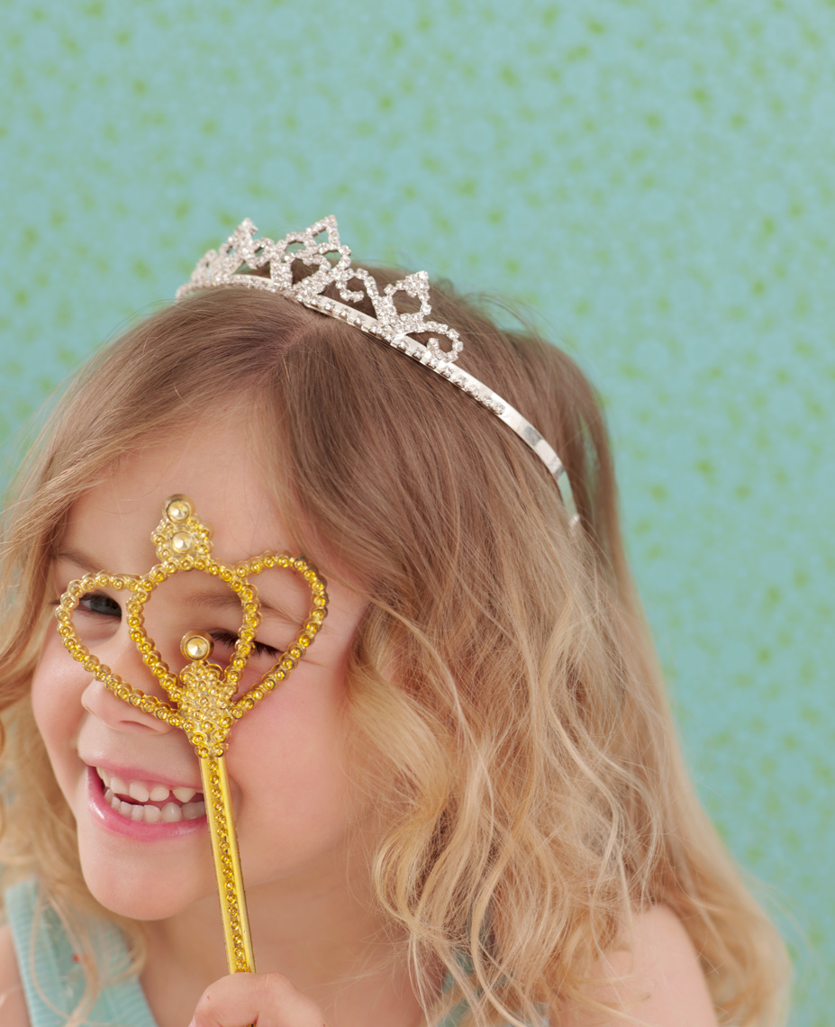 little girl with princess crown and princess wand with background