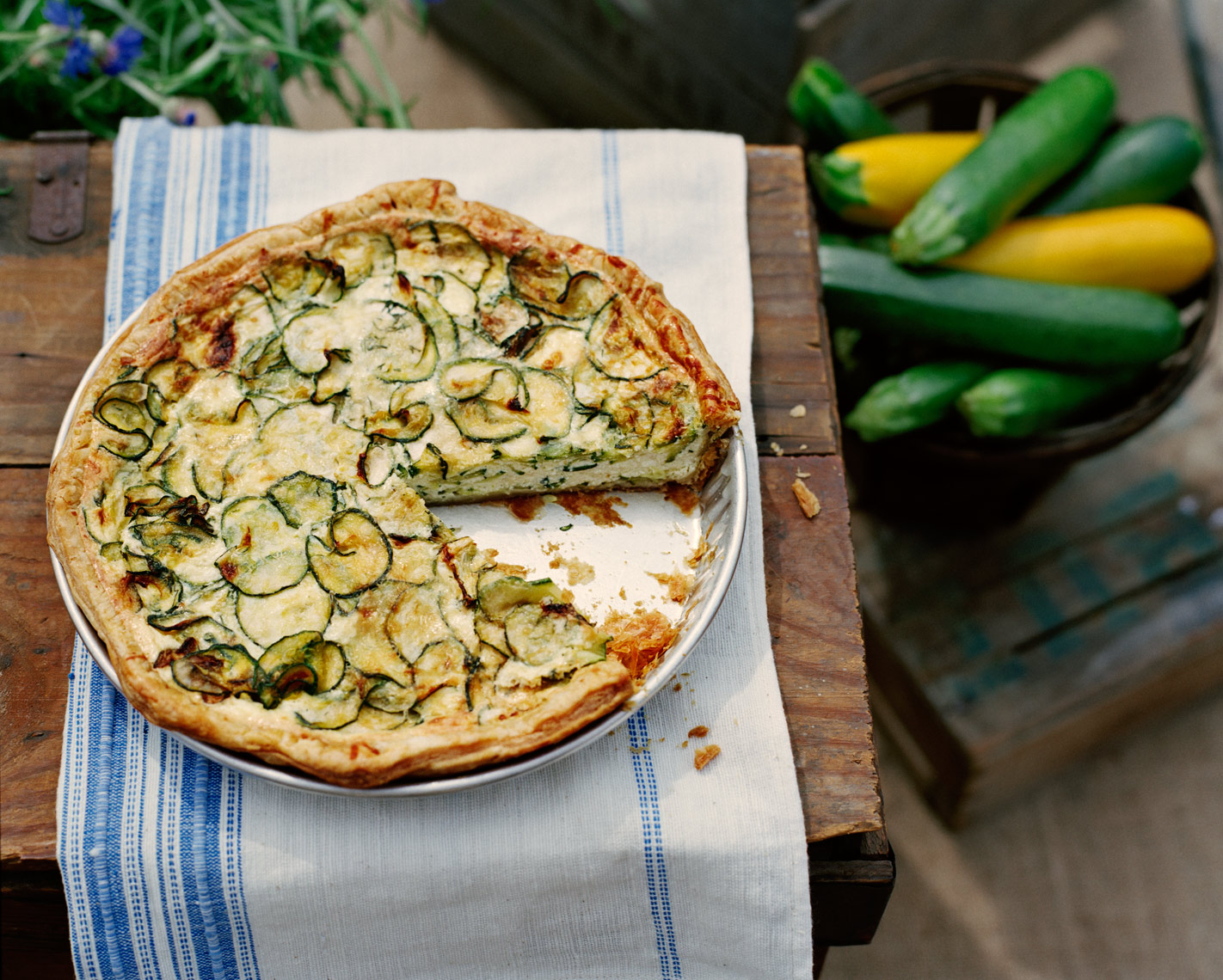 zucchini quiche with farmers market produce with vintage linen